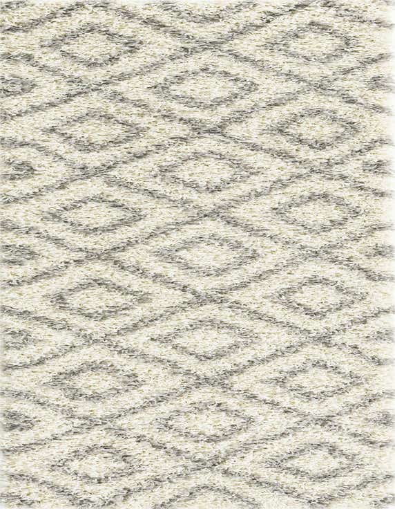 A 7 ft runner rug in ivory and gray with a modern geometric lattice pattern and high/low shag pile.
