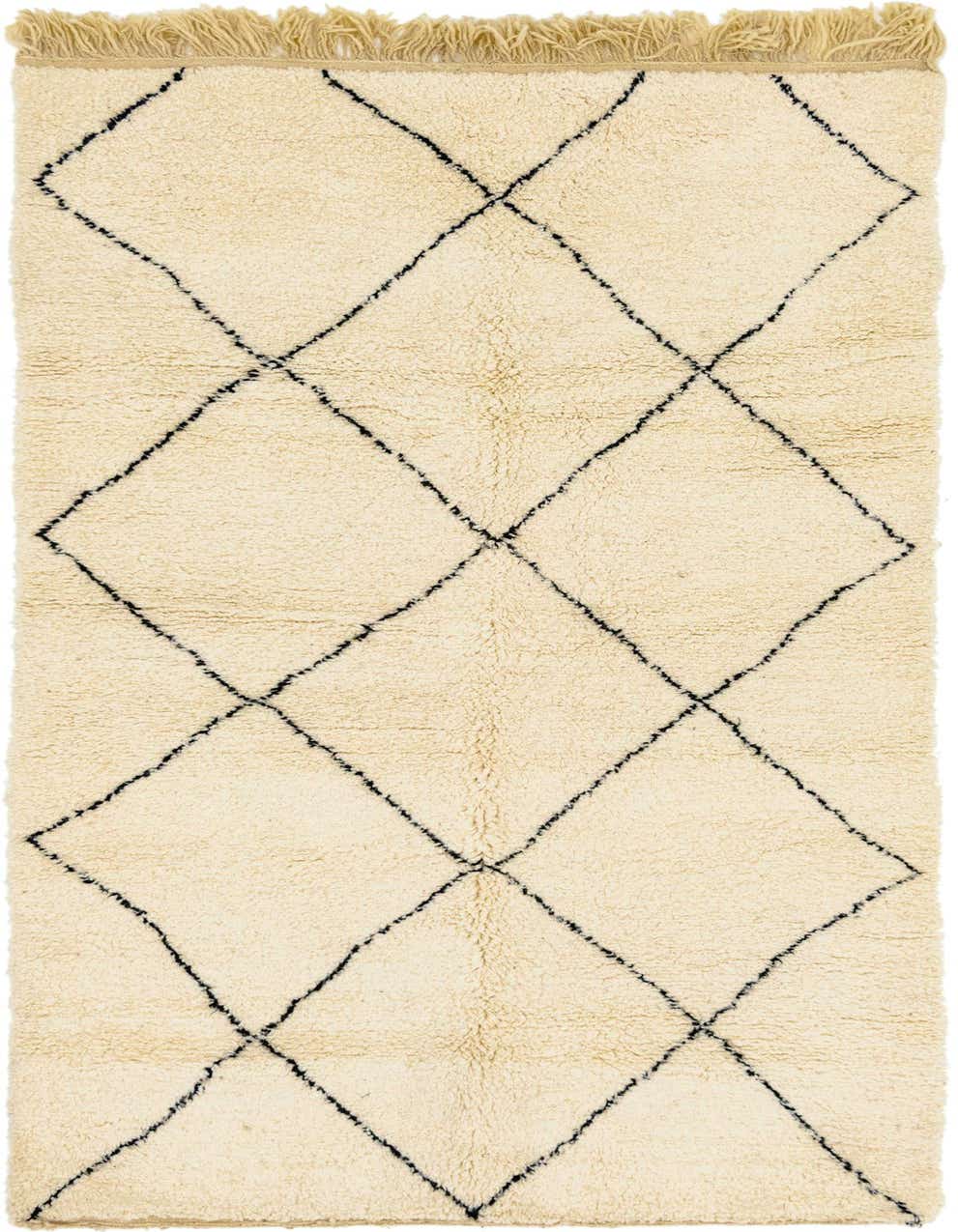 A 9 ft runner rug in ivory wool with a black tribal diamond pattern and shag pile, perfect for a hallway.