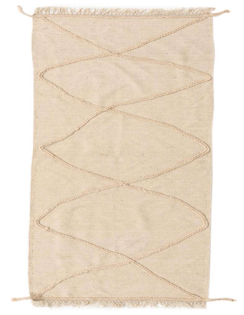 An 8 ft ivory wool runner rug with a shag pile and a modern tribal diamond pattern, perfect for a hallway.