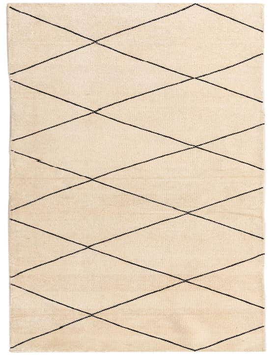 A 10 ft ivory runner rug with a black tribal diamond pattern, perfect for a hallway.