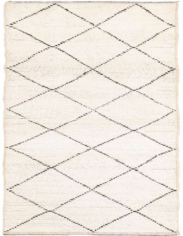 An 8 ft runner rug from the Moroccan collection, featuring an ivory shag pile with a black tribal diamond pattern, ideal for a hallway.