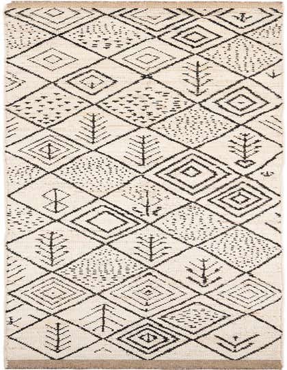 A 14 ft ivory wool runner rug with a black tribal geometric pattern, featuring diamonds and abstract tree-like motifs, perfect for a hallway.