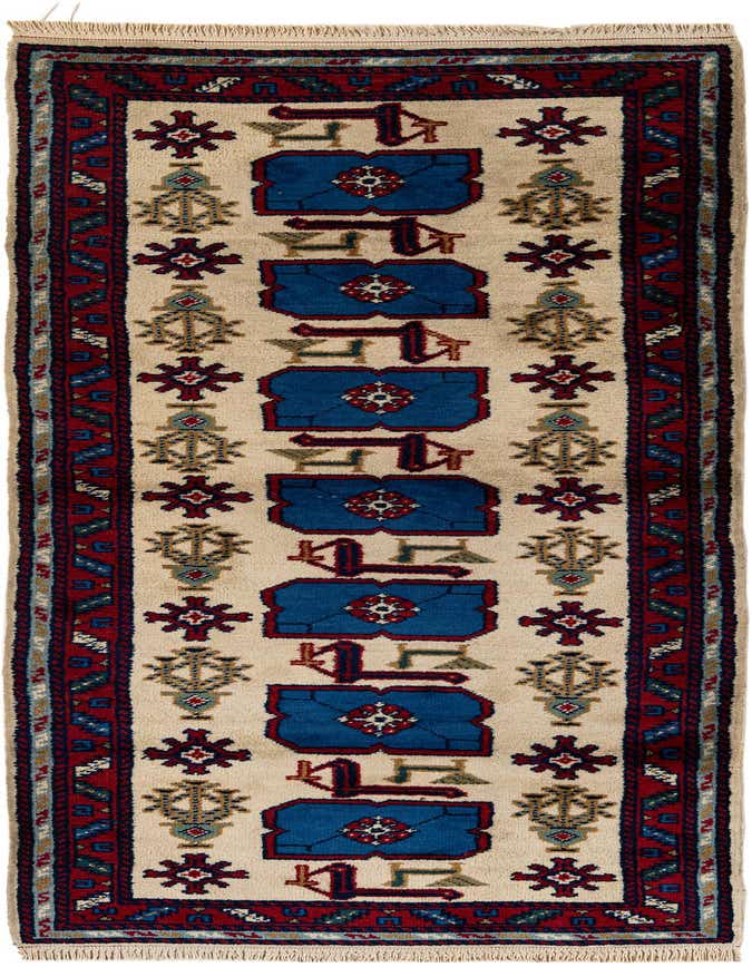 A 9 ft runner rug with a cream background, featuring tribal blue, red, and green patterns, ideal for a hallway.