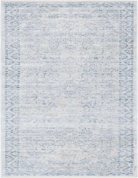 A 10 ft runner rug in ivory and cream with a distressed traditional medallion pattern and blue accents.