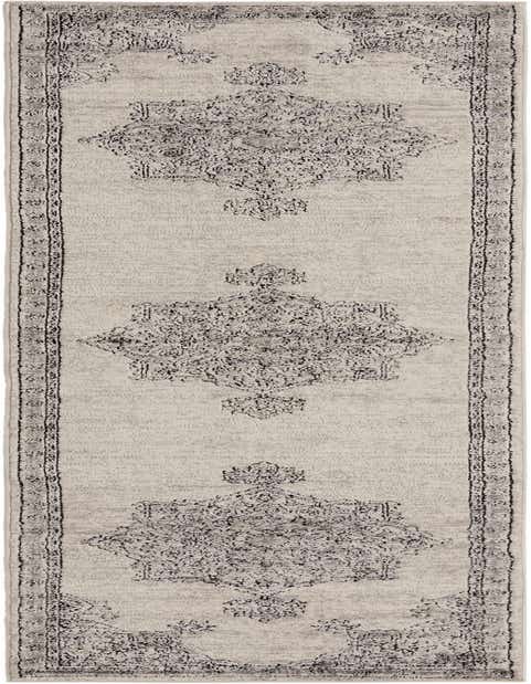 A 12 ft runner rug from the Nyla collection, featuring a distressed ivory background with traditional black medallion patterns and a border, ideal for a hallway.