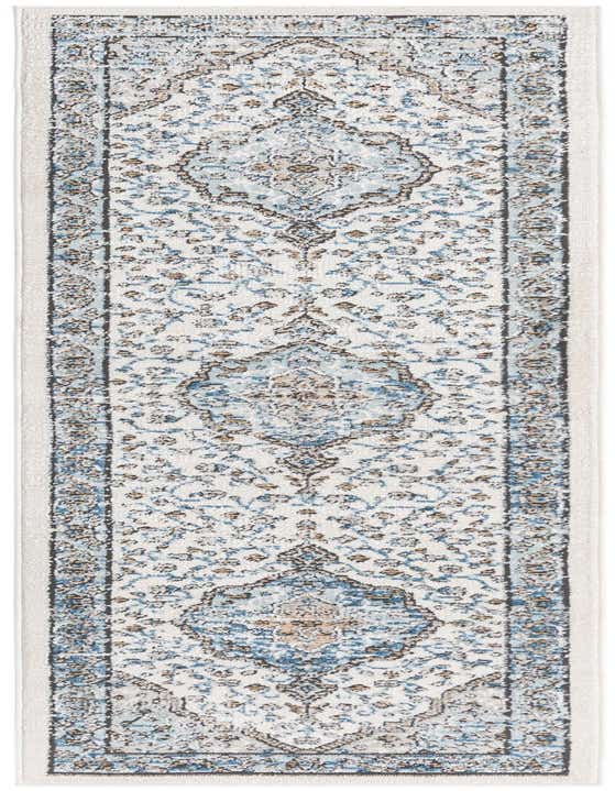 An 8 ft runner rug with a distressed traditional pattern in shades of ivory, cream, white, and light blue, ideal for a hallway.