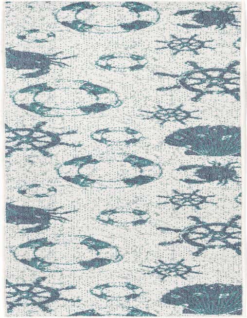 An 8 ft runner rug with a white background and a repeating pattern of teal and blue nautical elements like life preservers, crabs, and ship wheels.