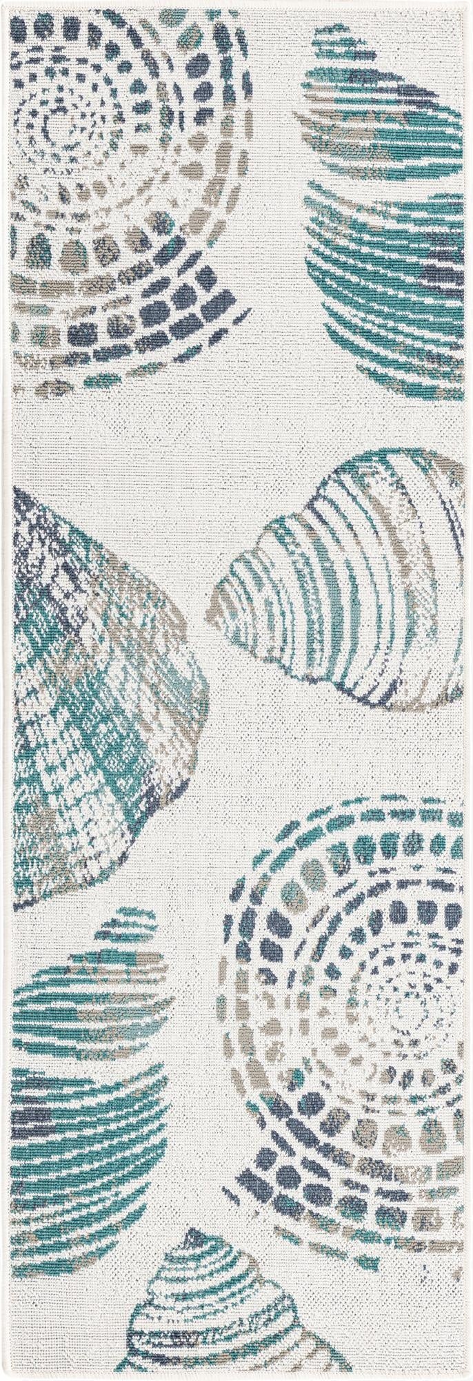 A 6 ft runner rug featuring an abstract coastal pattern of teal, blue, and grey seashells on an ivory background, suitable for a hallway or patio.