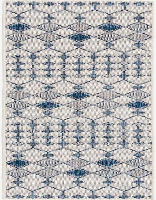 An 8 ft runner rug with an ivory background and a repeating blue tribal trellis pattern, suitable for a hallway or patio.