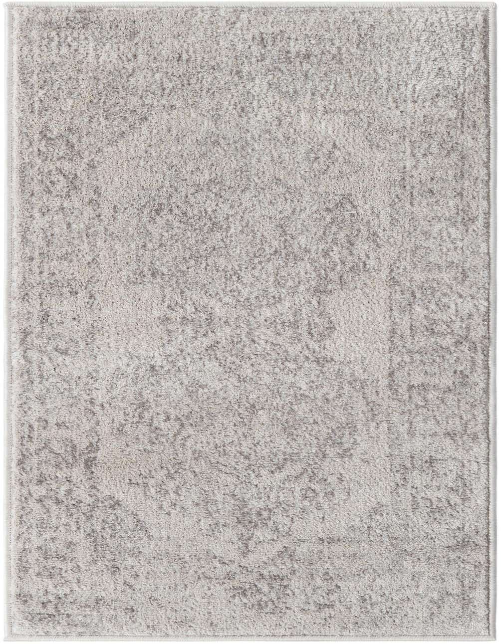 A 4 Ft Runner rug from the Oxford collection, featuring a distressed traditional pattern in ivories and creams.