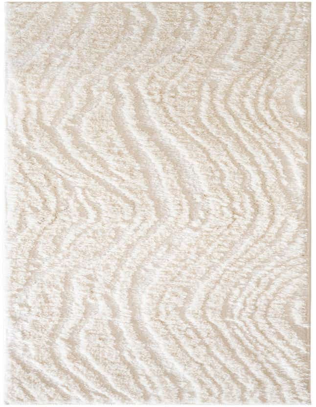 A 6 ft runner rug from the Sepia collection, featuring a modern abstract pattern in ivory and cream with a textured pile, ideal for a hallway.