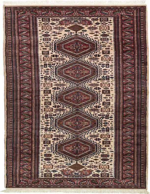 A 10 Ft Shirvan runner rug in ivory and red with traditional tribal patterns, ideal for a hallway.