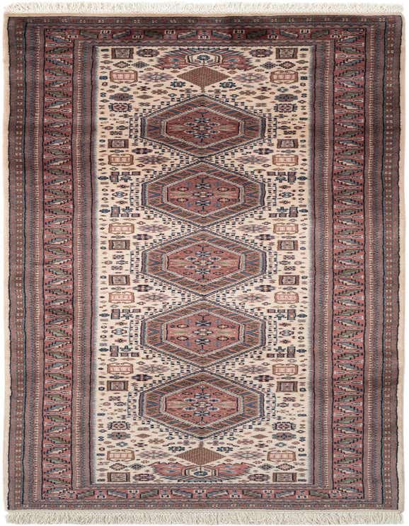 A 10 ft runner rug with a tribal, traditional pattern in ivory, cream, and red tones, perfect for a hallway.