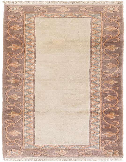A 10 ft ivory runner rug with a brown border featuring an elegant floral and scroll pattern, perfect for a hallway.