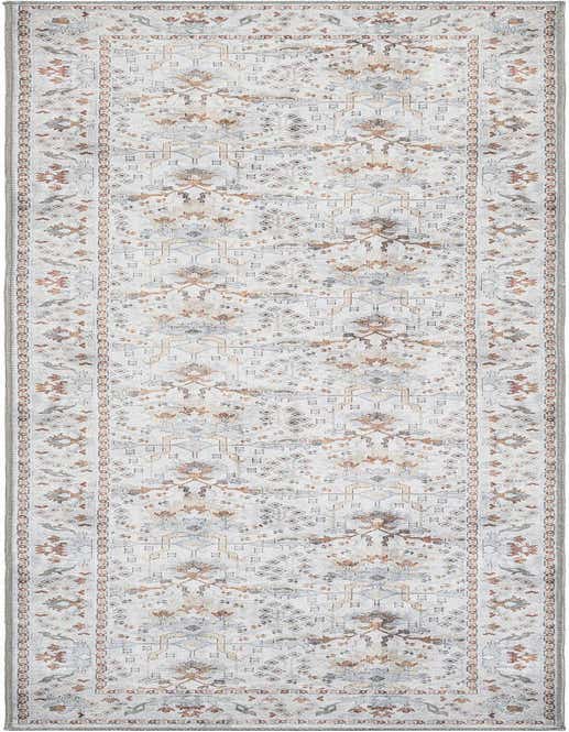 A 10 ft runner rug in ivory and cream with a traditional medallion and floral pattern in muted rust, grey, and gold tones.