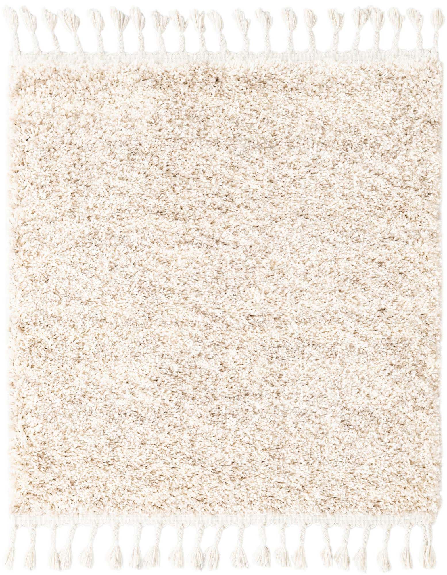 A plush ivory shag square rug with braided tassels on two sides, showcasing its soft texture and neutral tone.
