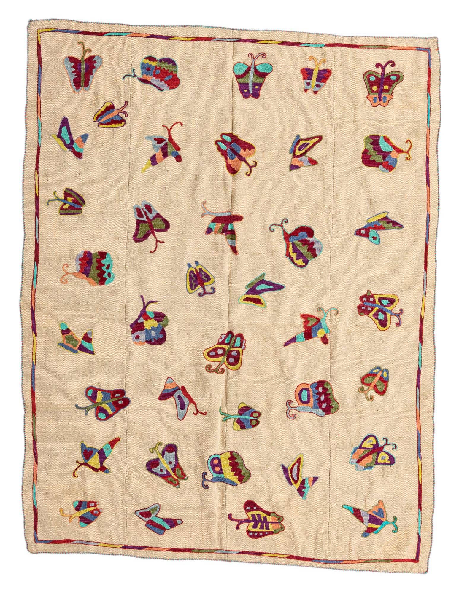 A 5' 2 x 6' 8 square ivory flatweave rug with colorful tribal butterfly patterns and a thin border.
