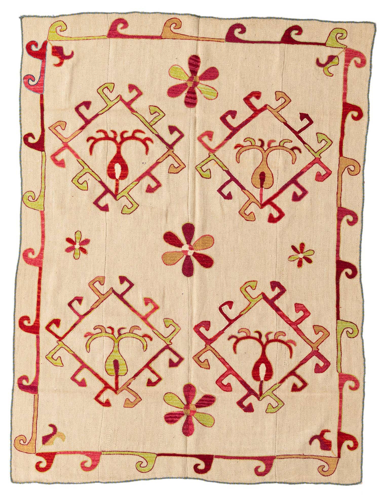 A 4' 10 x 6' 9 ivory wool Kilim Suzani rug with tribal red and green abstract patterns and a decorative border.