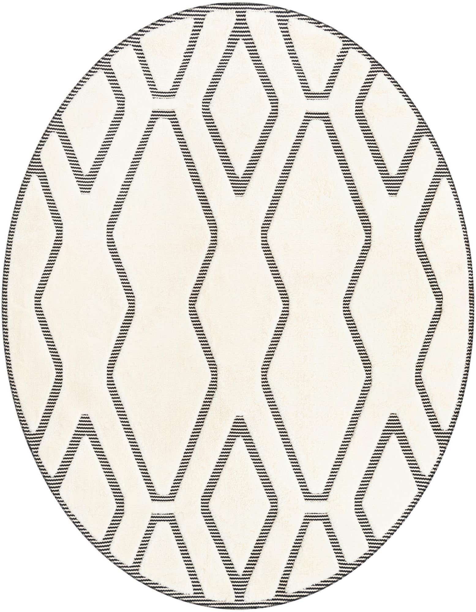 A round ivory and black rug featuring a bold geometric pattern of interlocking diamonds and zigzags.