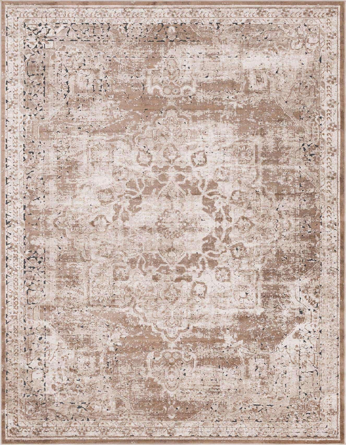 A 6x9 rectangular Rugs.com Eliza rug with a distressed medallion pattern in shades of brown, tan, and ivory.