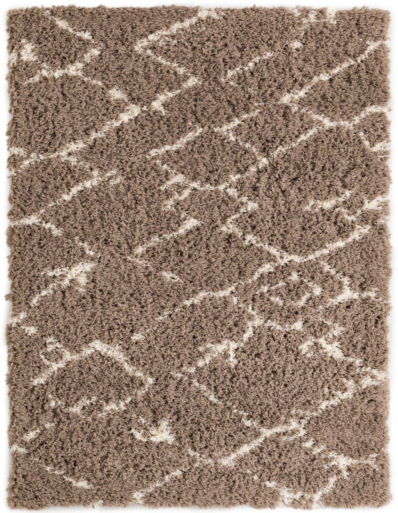 A rectangular 5x8 brown shag rug with a modern ivory geometric pattern, perfect for a living room.