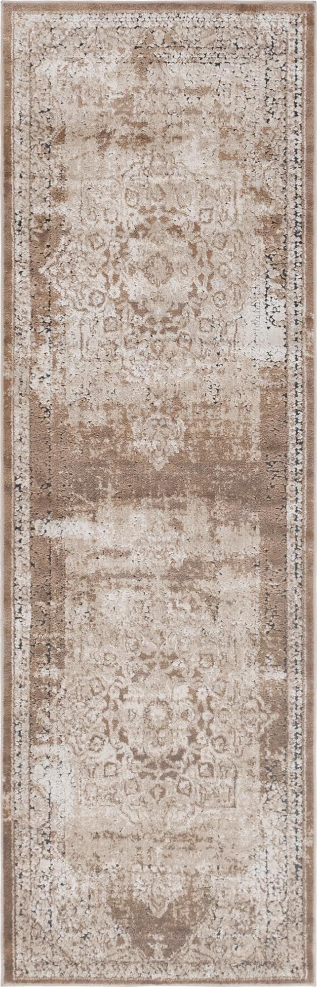 A 7 ft runner rug in shades of brown, tan, and cream with a distressed traditional medallion pattern, ideal for a hallway.