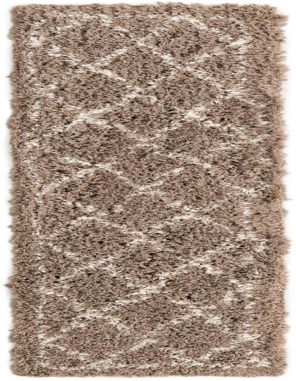 A long, rectangular 8 ft runner rug with a thick brown shag pile and an abstract ivory modern pattern.