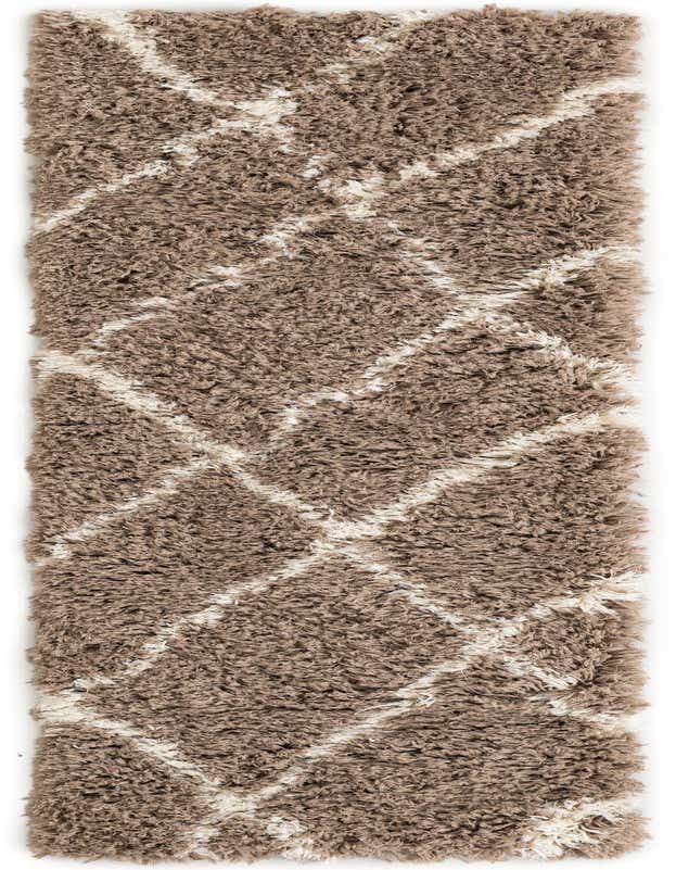 A long 8 ft runner rug in brown and ivory shag, featuring a modern geometric diamond pattern, ideal for a hallway.