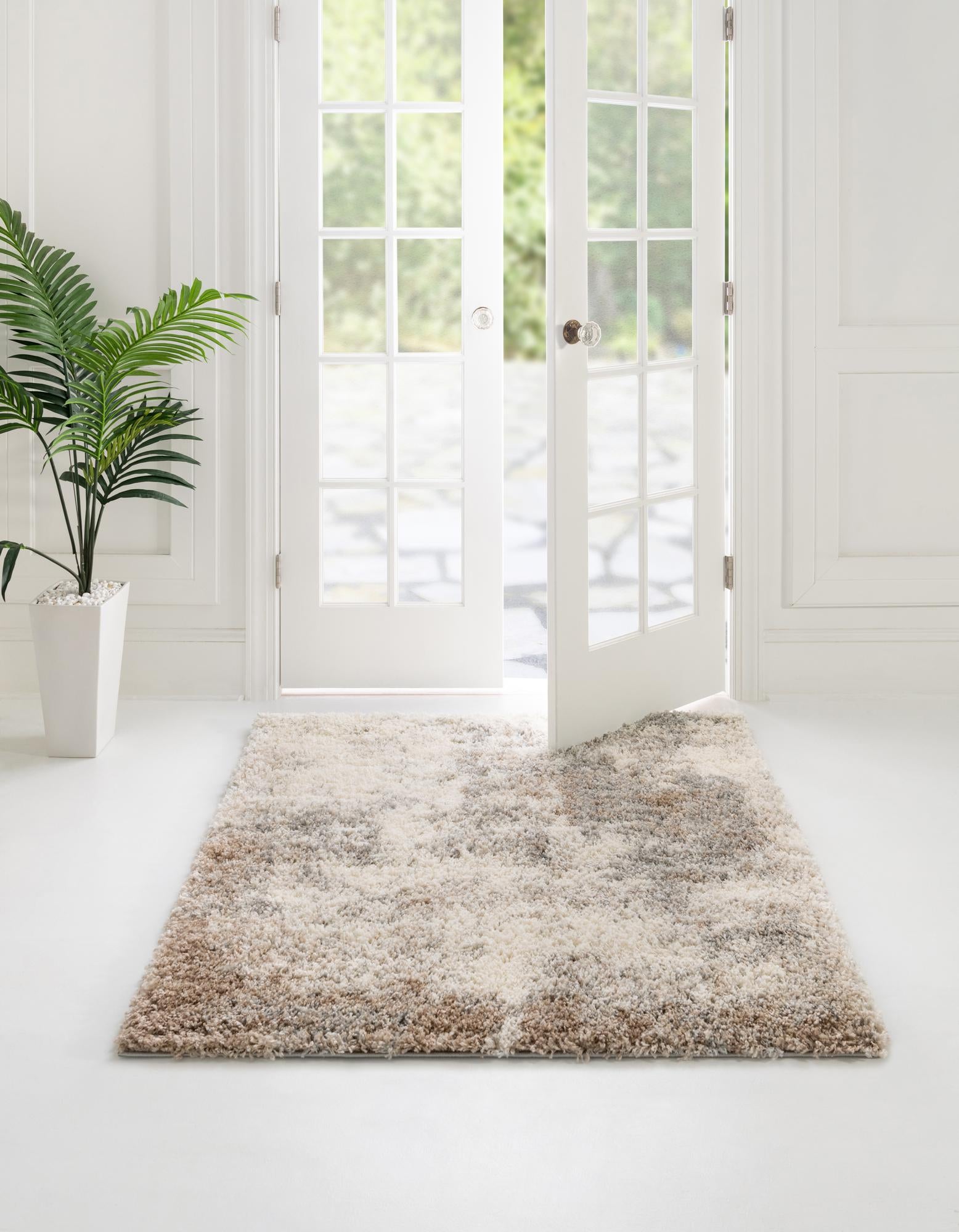 A square 5' x 5' Soft Touch Shag rug by Rugs.com with a textured pile in shades of brown, tan, and cream.