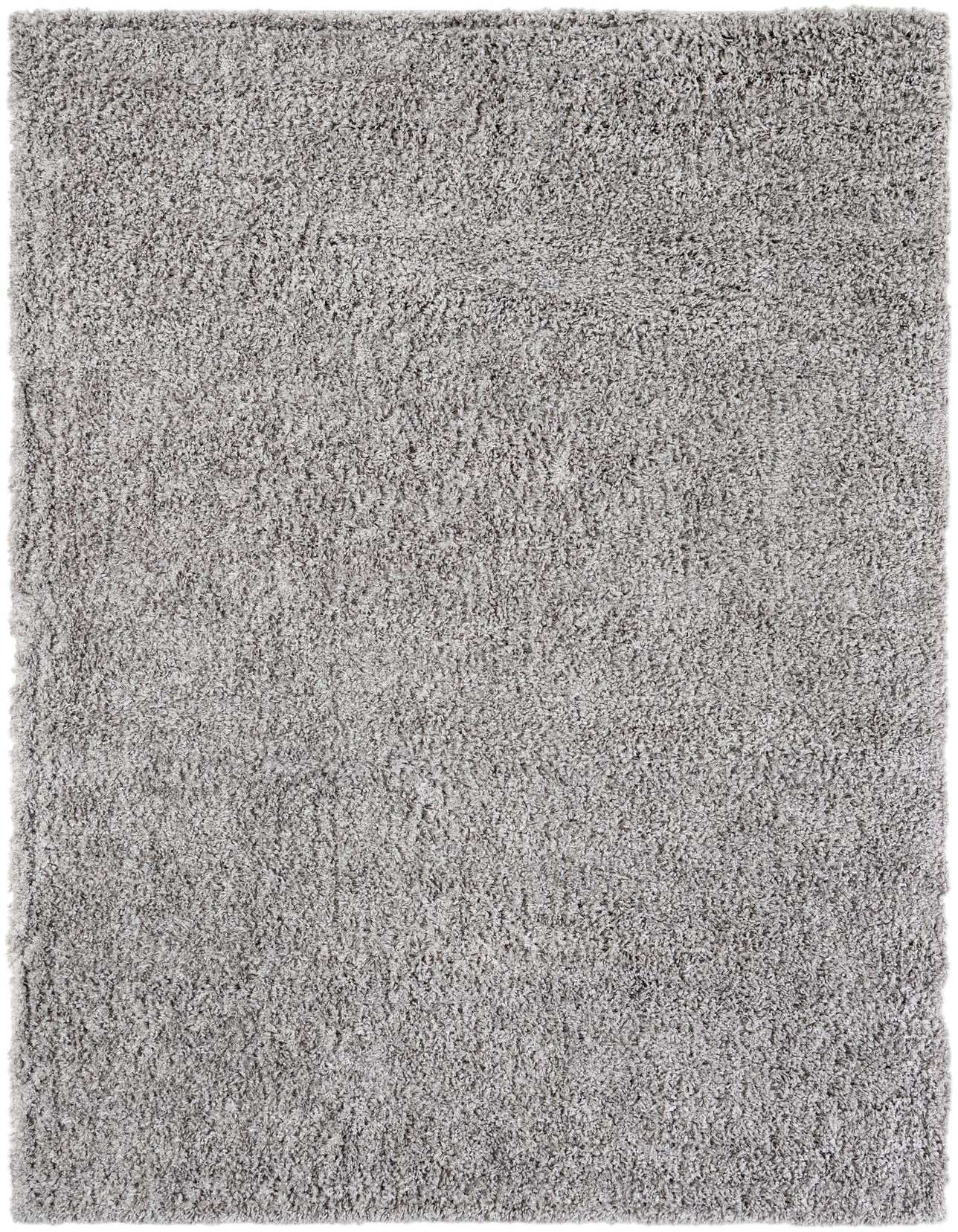 A 6x9 light grey rectangular shag rug with a soft, textured pile, perfect for a modern living room.