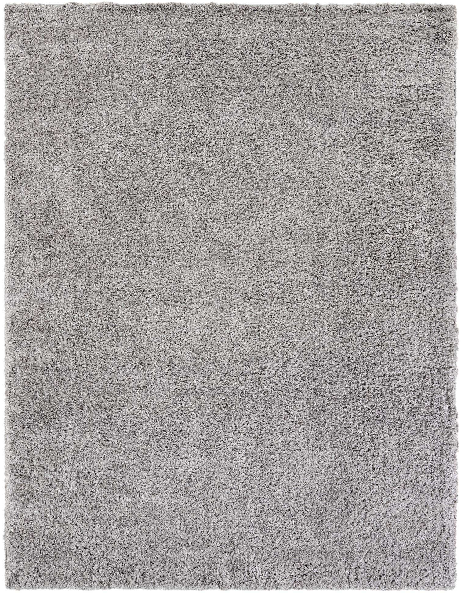 A light grey 8x10 rectangular shag area rug with a plush, textured pile, perfect for a modern living room.