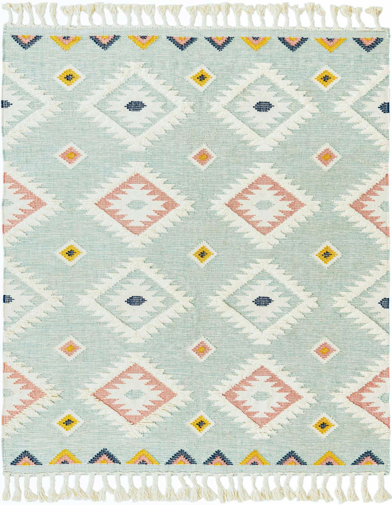 A 7x10 rectangular light aqua Southwestern rug with a tribal diamond pattern in pink, yellow, and navy, featuring a textured shag pile and fringe.