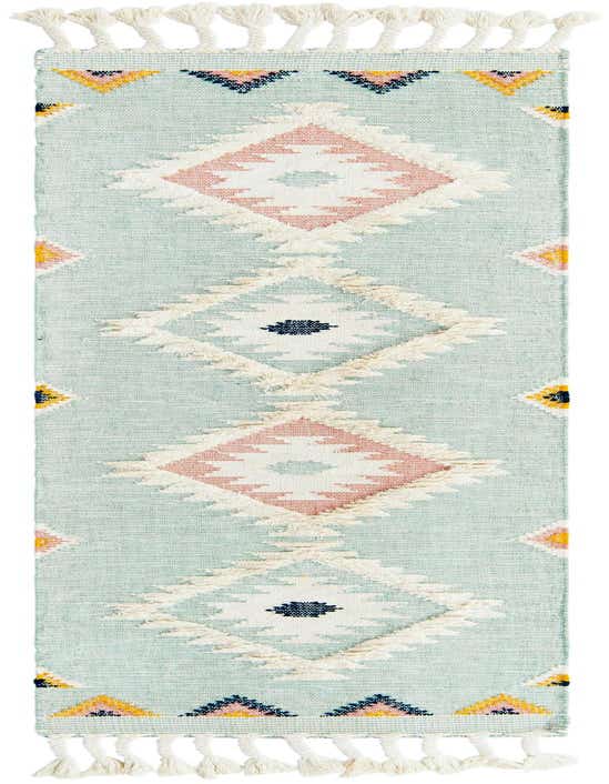 A light aqua Southwestern runner rug with white tassels, featuring pink, white, and navy tribal diamond patterns.