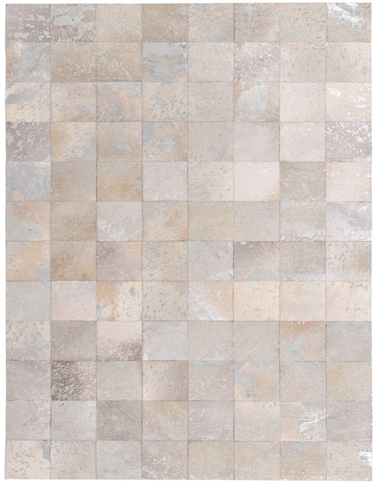 A 5x8 rectangular Cowhide rug in Ivories/Creams with a modern, abstract patchwork pattern, ideal for a living room.