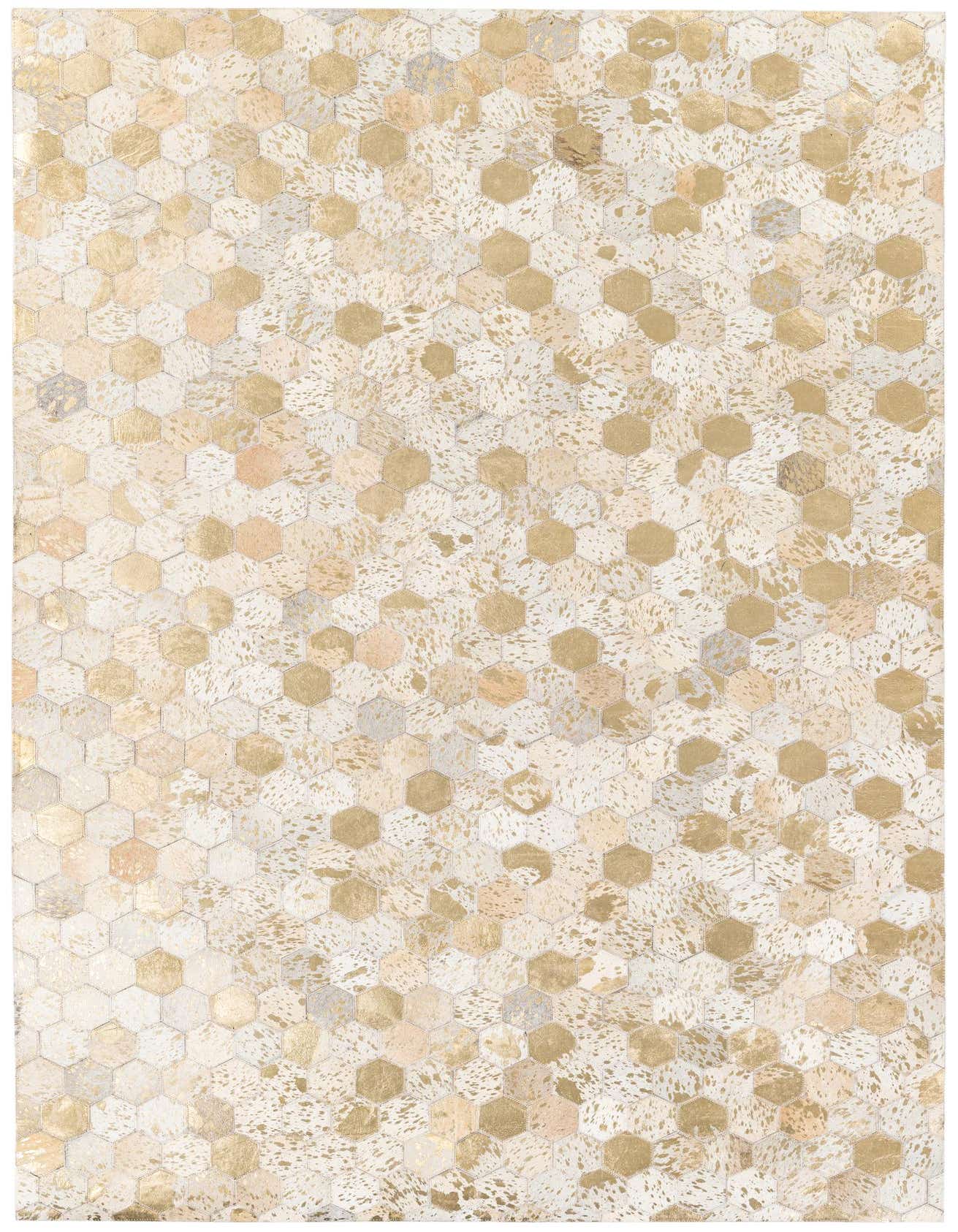 A rectangular 5x7 modern rug featuring a mosaic of ivory, cream, and gold hexagonal cowhide patches.