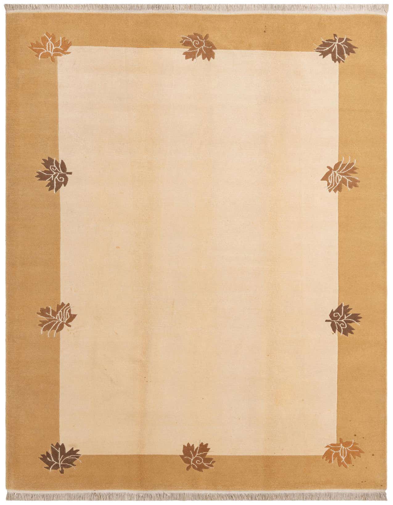 A 7x10 rectangular ivory and cream rug with a wide tan border featuring scattered brown and white leaf motifs.