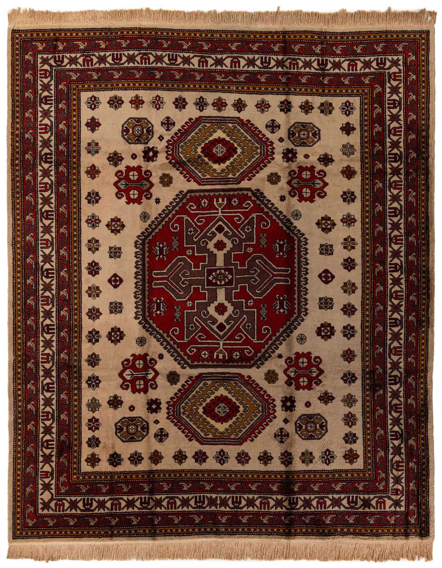 An 8x10 rectangular Heriz wool rug featuring a traditional medallion pattern in ivories, creams, and deep reds.