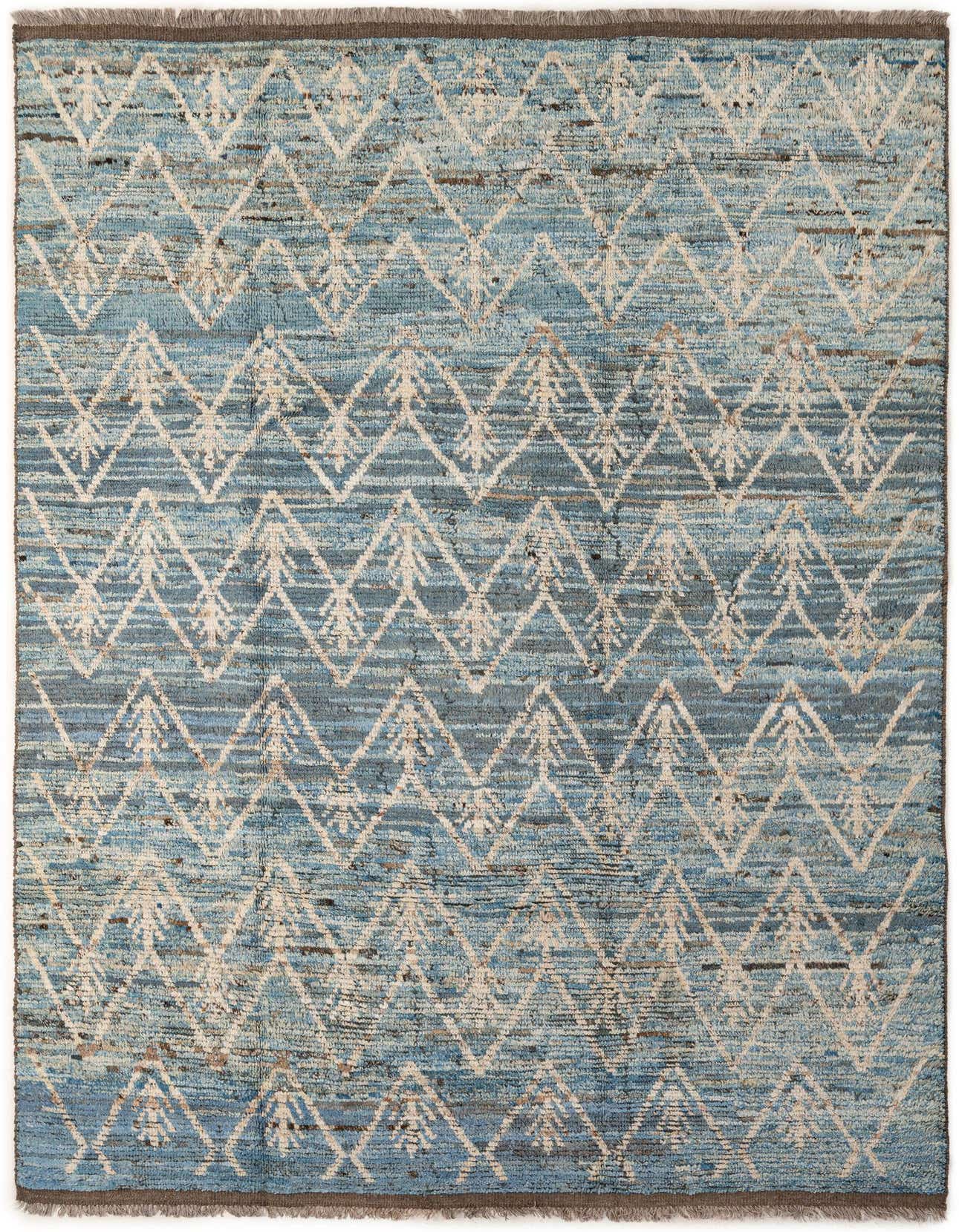 A 7x10 rectangular Moroccan rug with a tribal pattern in shades of blue and cream, featuring a medium pile.