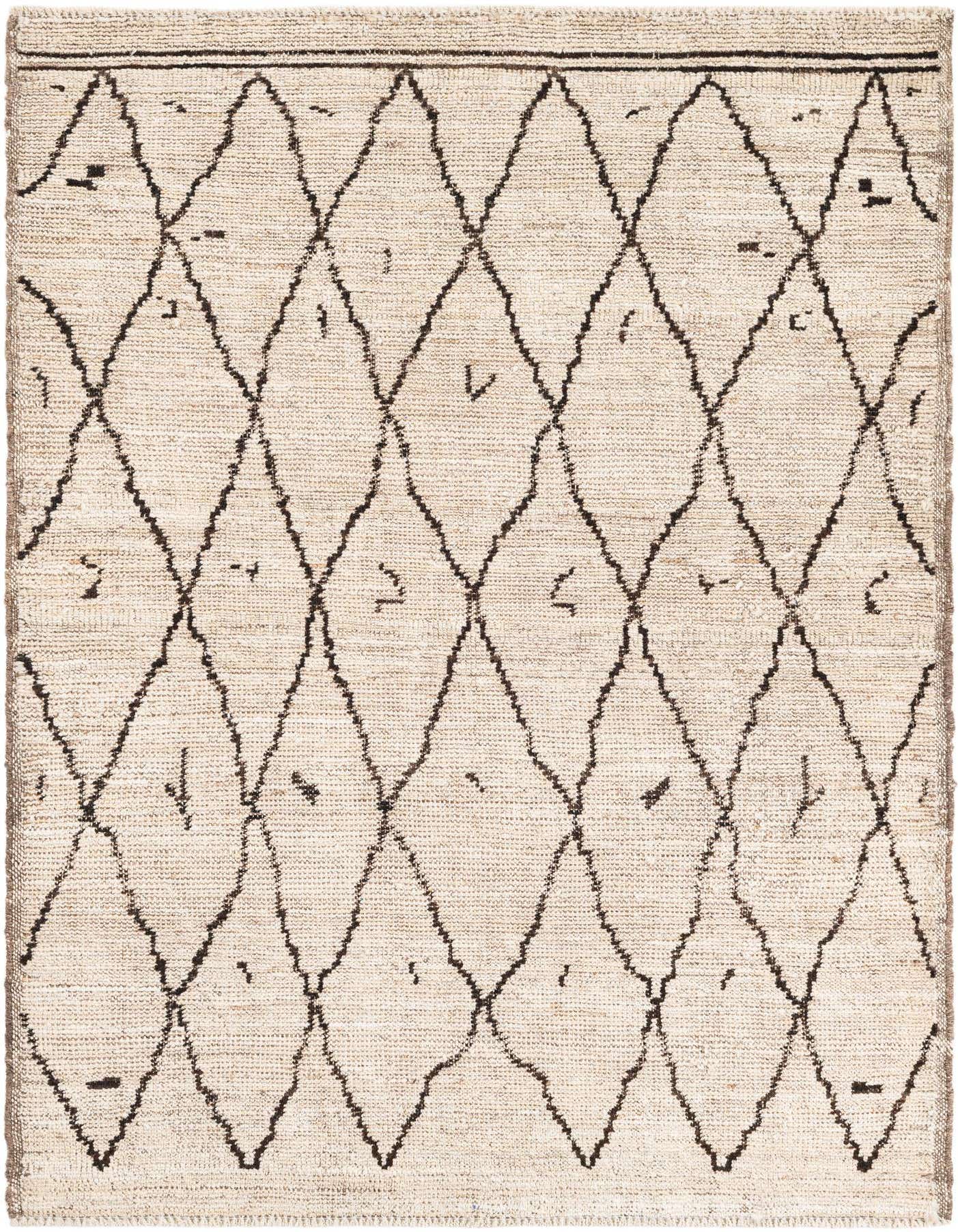 A 4x6 rectangular ivory wool shag rug with a bold black tribal diamond pattern, perfect for a living room.