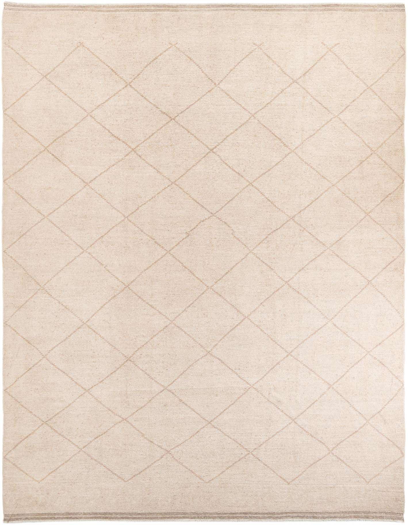 A 10x14 rectangular ivory wool shag rug featuring a subtle cream tribal diamond pattern, ideal for a living room.