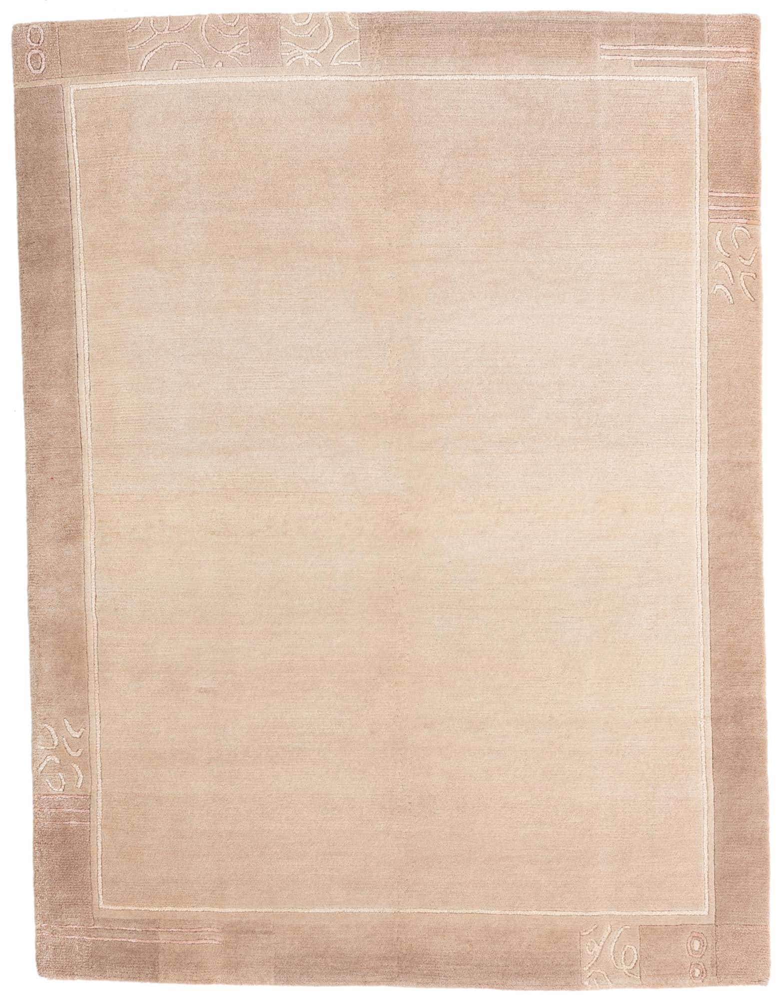 A 5x8 rectangular ivory and cream modern rug with a subtle abstract border, perfect for a living room.