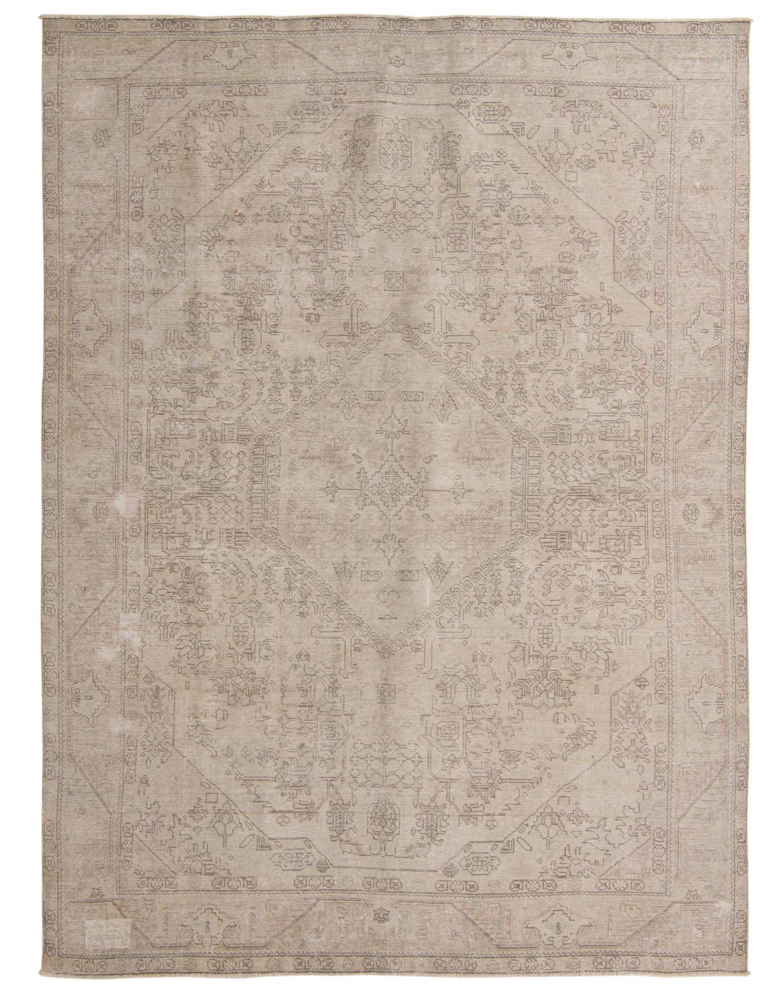 An 8x11 rectangular ivory wool rug with a subtle, faded Persian-inspired pattern, ideal for a living room.