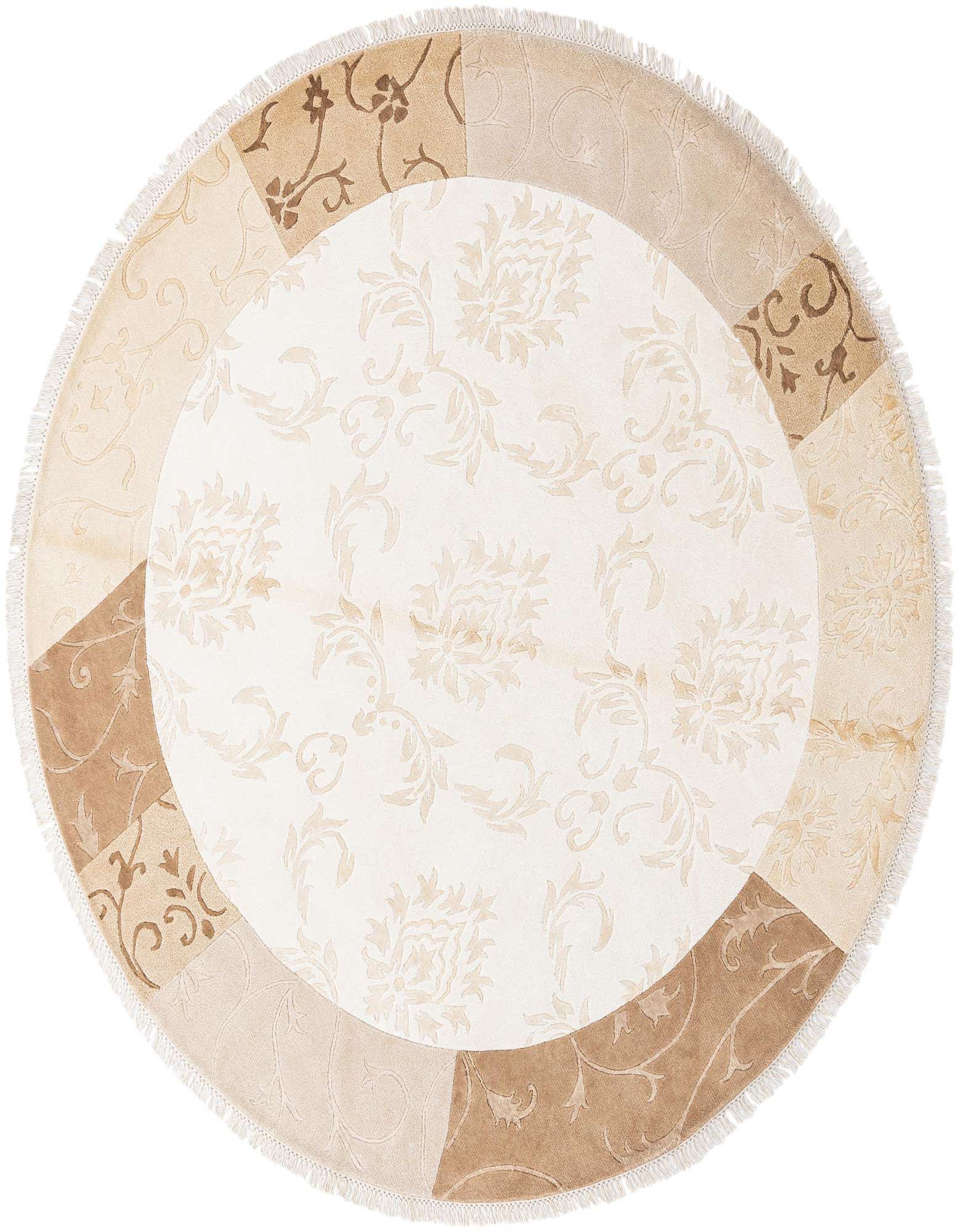 A round ivory and cream rug with a modern oriental pattern, featuring a patchwork-style border in varying shades of beige and brown, with fringe.
