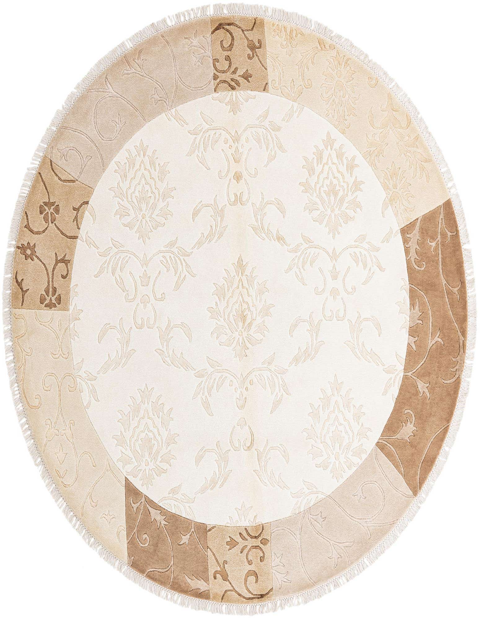 A round ivory and cream rug with a central floral medallion and a border featuring alternating modern and oriental patterns, finished with fringe.