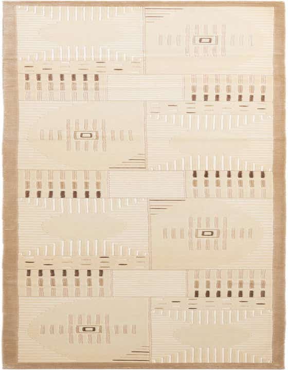 A 10 ft runner rug in ivory and cream with a modern geometric and oriental pattern, featuring raised lines and squares.
