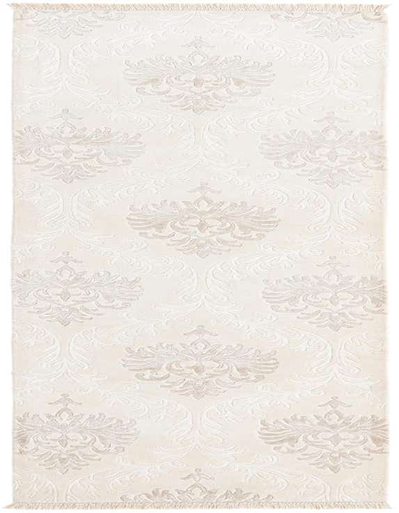 A 10 ft runner rug from the Darya collection featuring an ivory and cream modern oriental pattern with a high pile and fringed ends.