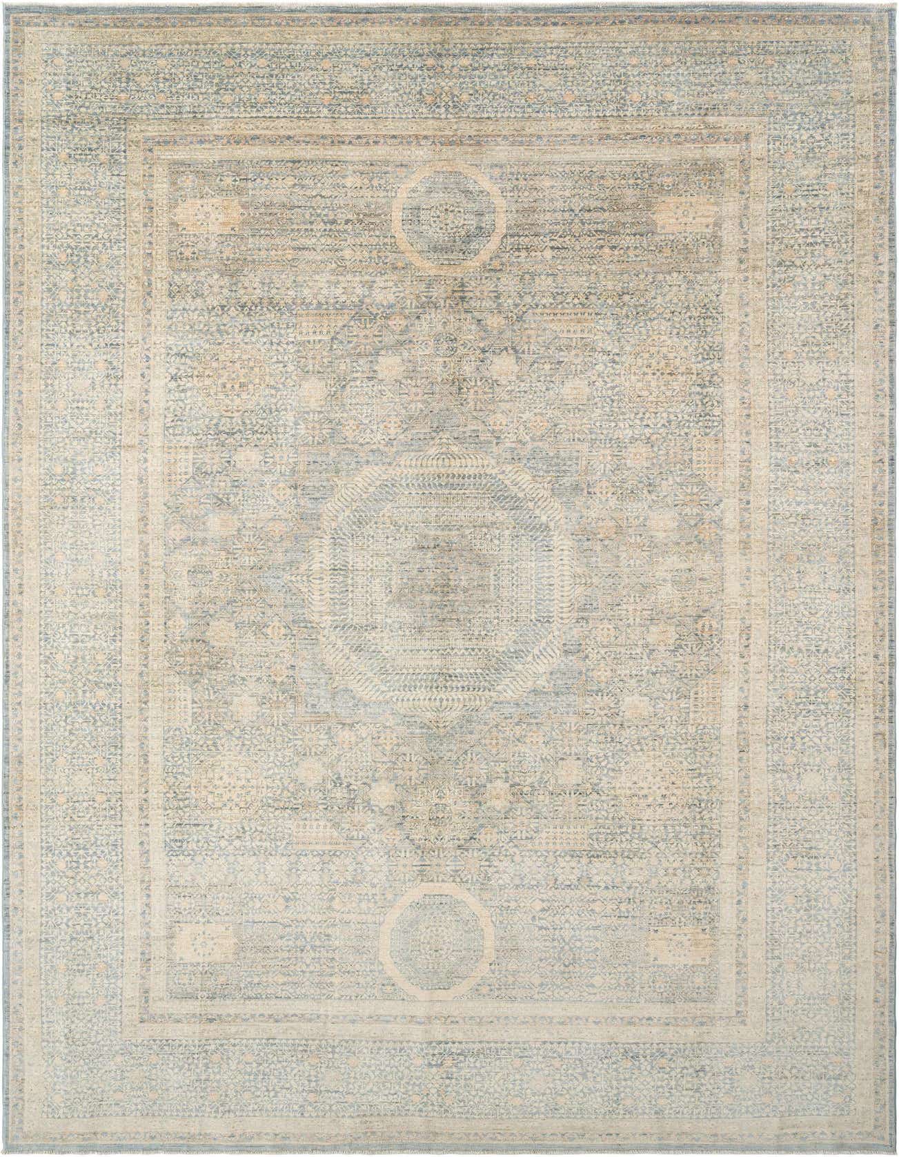 A rectangular handmade Persian rug in shades of light blue and cream, featuring intricate traditional patterns and a central medallion.