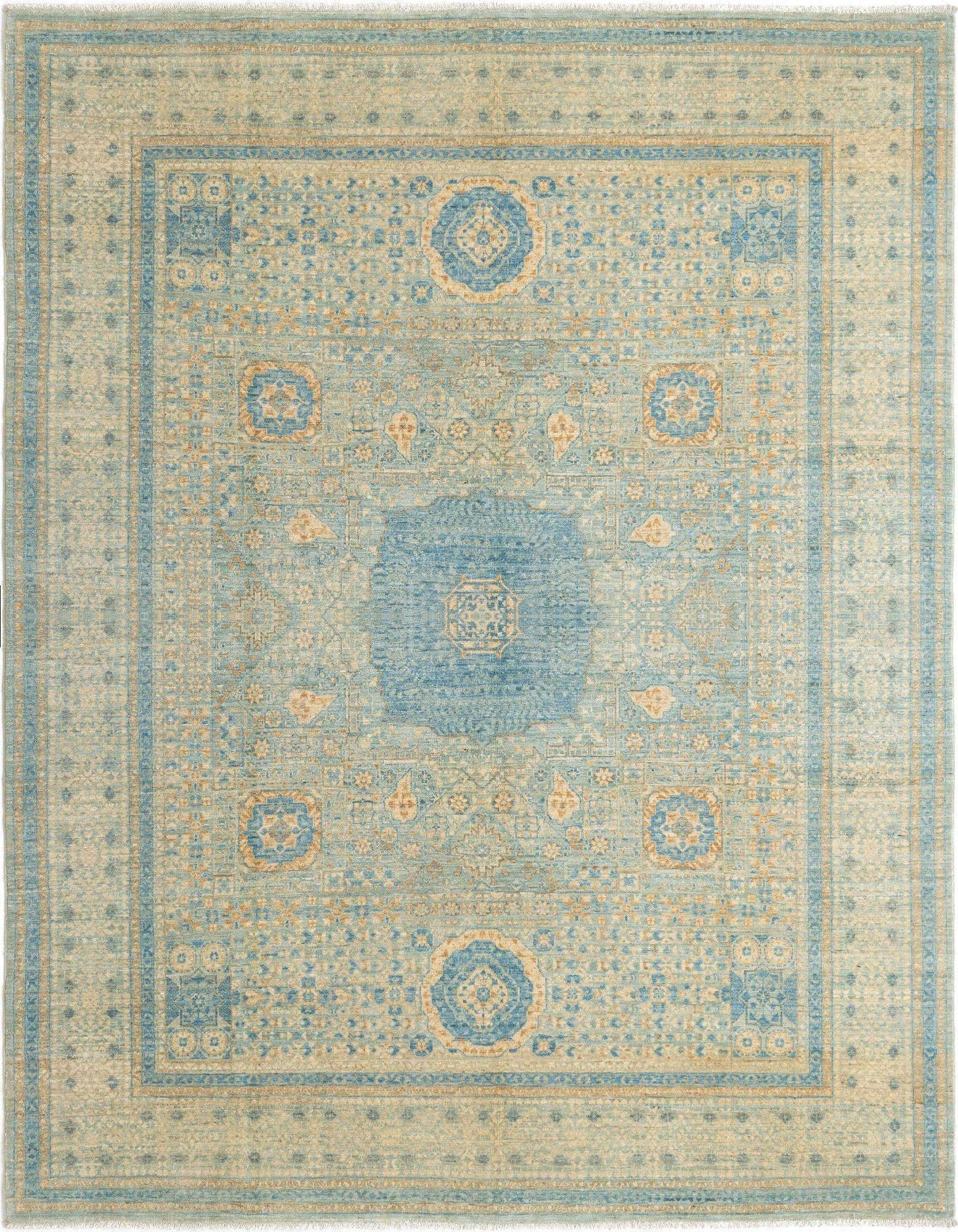 A rectangular handmade Persian rug in light blue and cream with intricate traditional patterns and a central medallion.