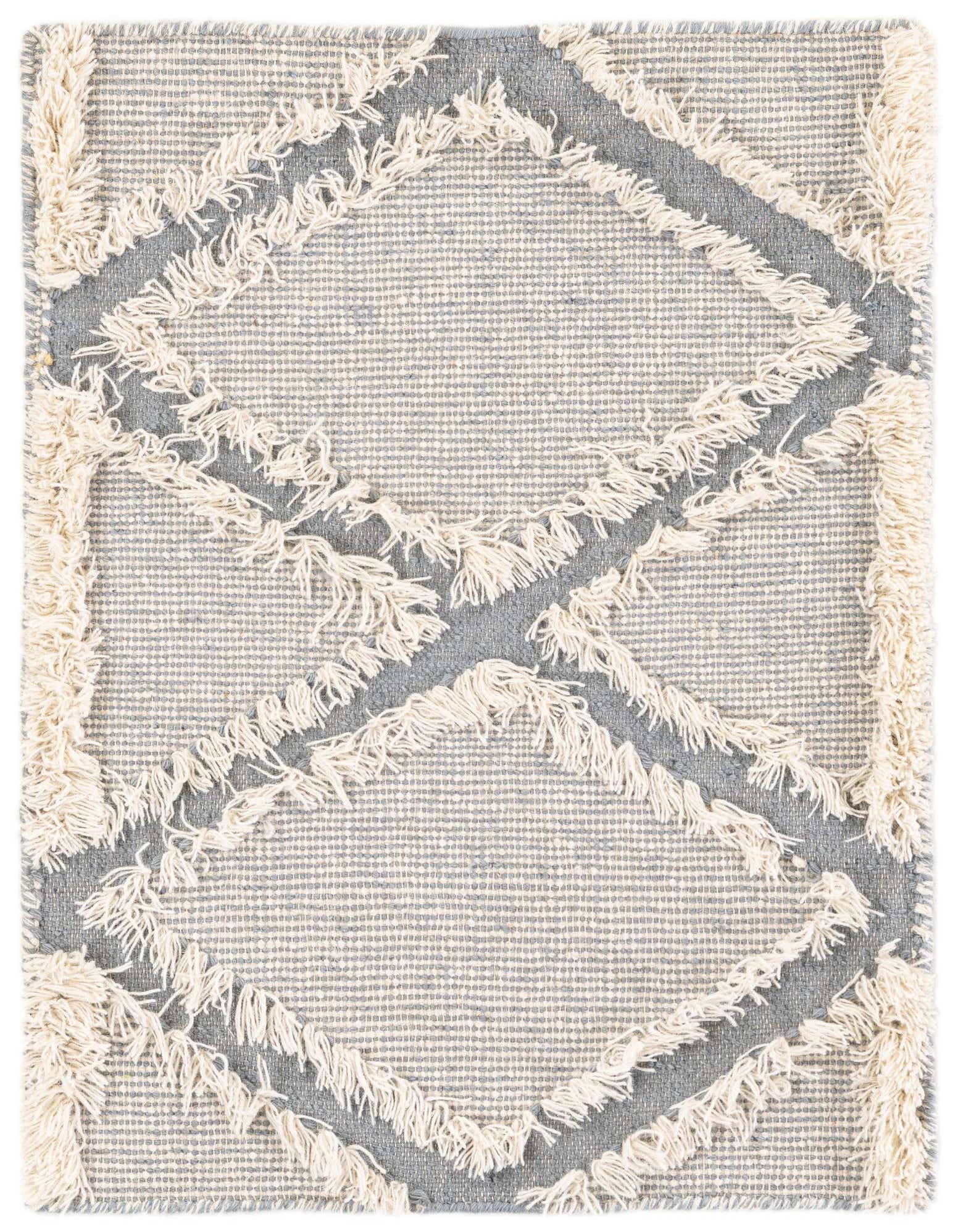 A 2x3 rectangular light blue modern wool shag rug with cream diamond patterns, handmade for indoor use.