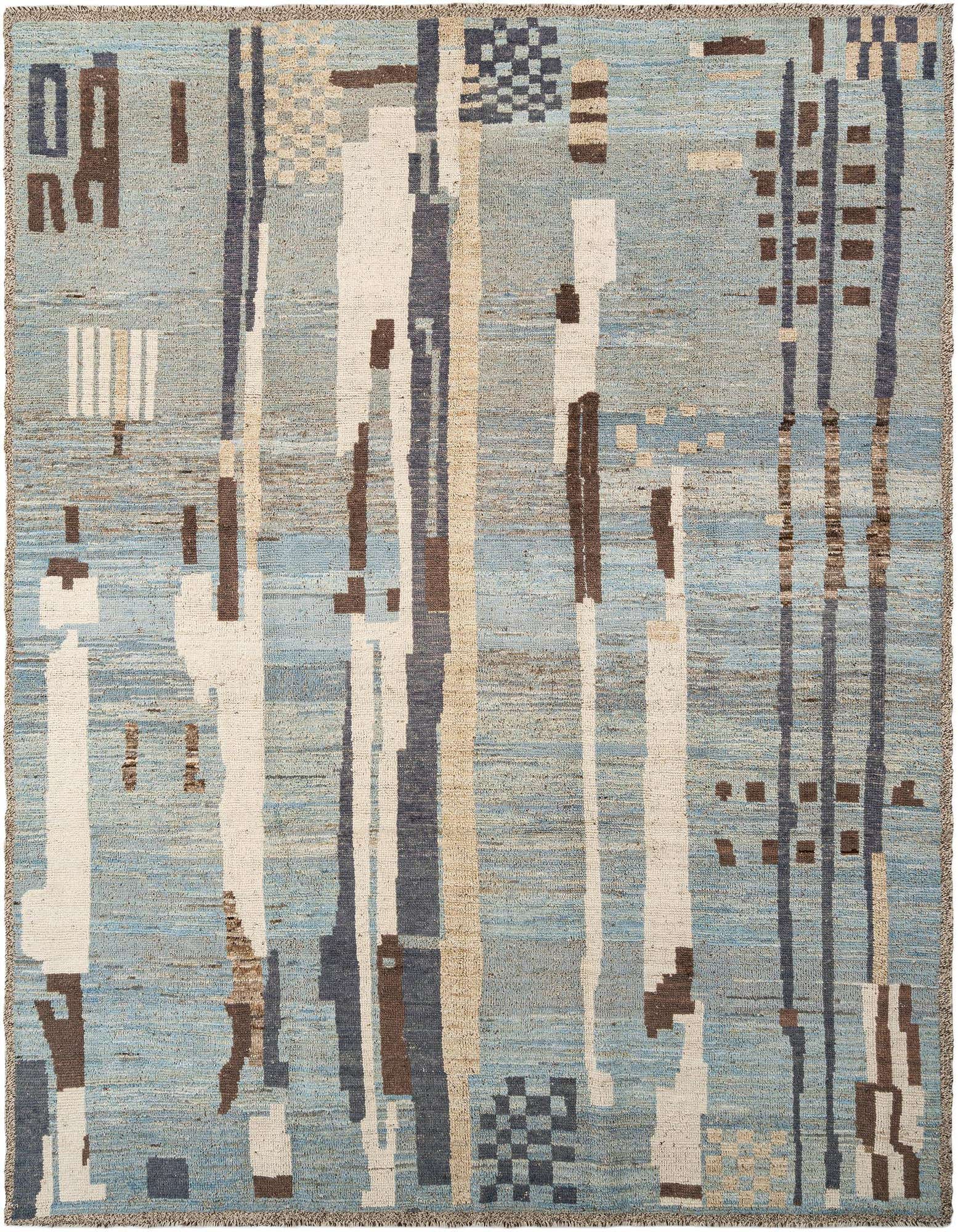 Handmade rectangular wool rug with a light blue background and abstract patterns in white, beige, brown, and dark blue.